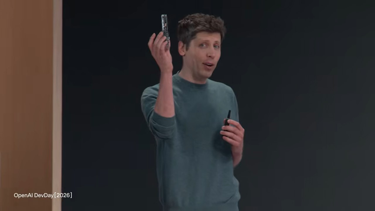 Altman holding up the ModRetro Chromatic handheld that every attendee got.